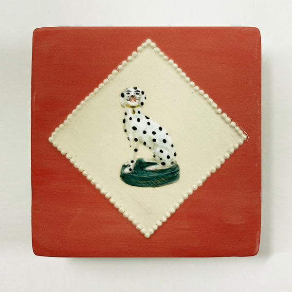 Red tile with painted dog in diamond shape